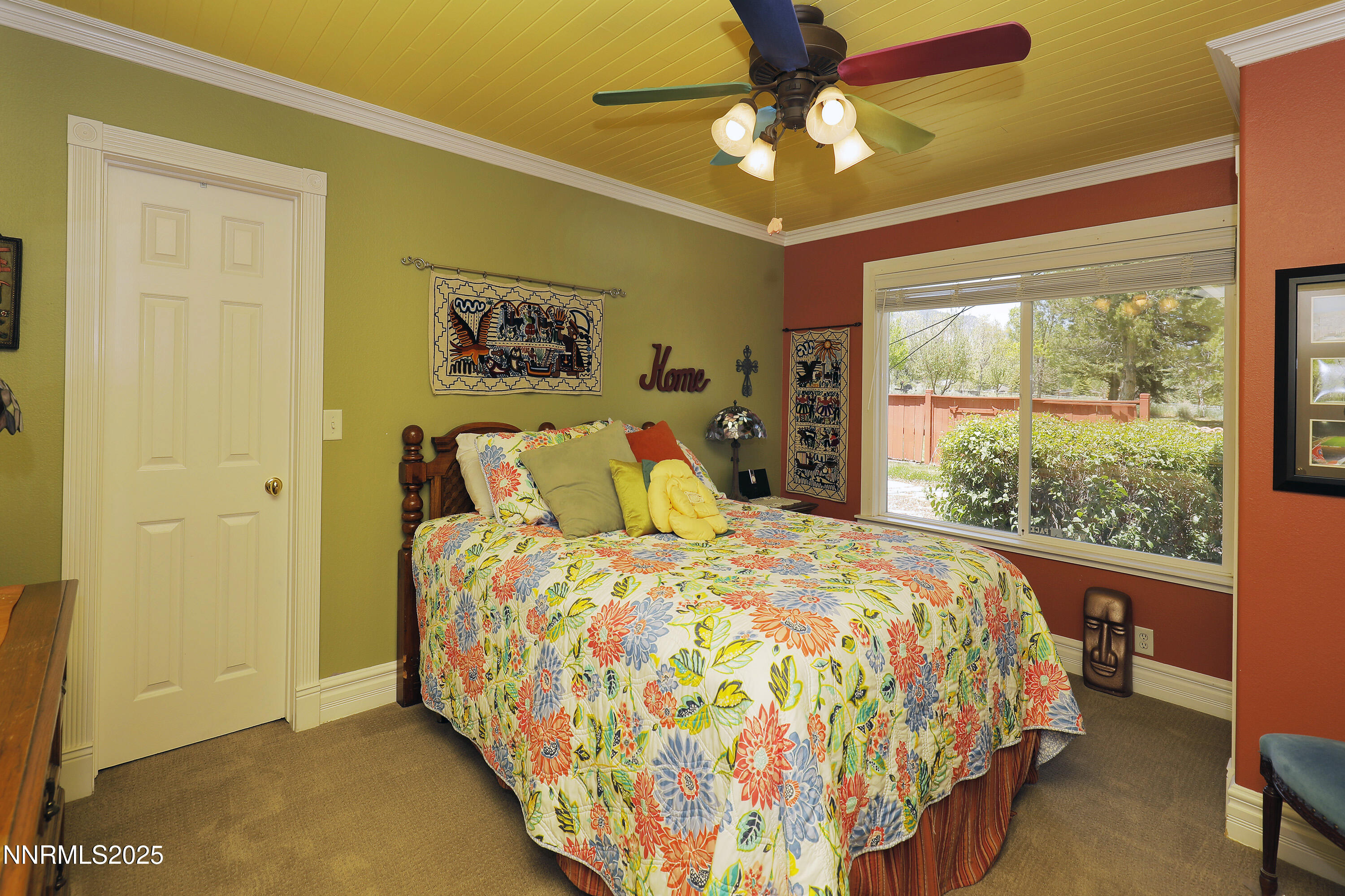 775 Foothill Road Gardnerville, NV 89460 - Photo 48 of 90 a bedroom with a bed and a chandelier
