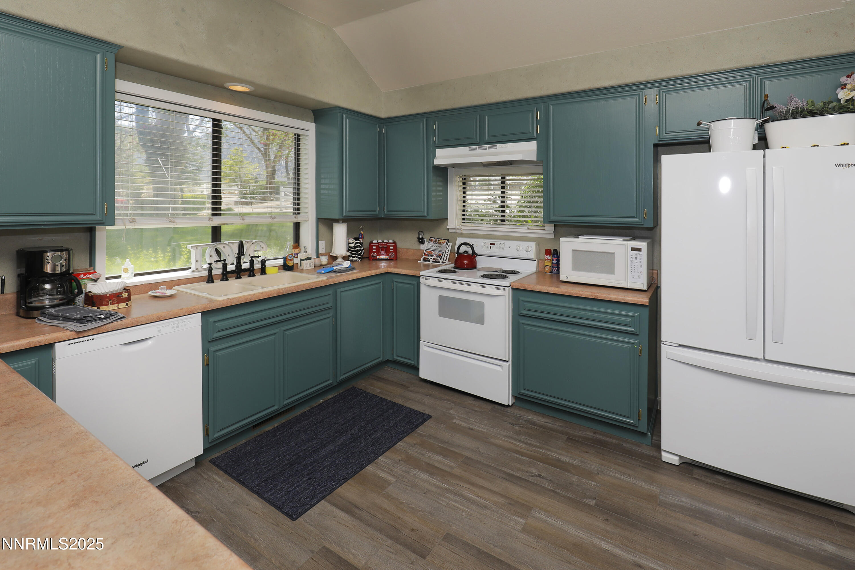 775 Foothill Road Gardnerville, NV 89460 - Photo 61 of 90 a kitchen with a cabinets and a refrigerator