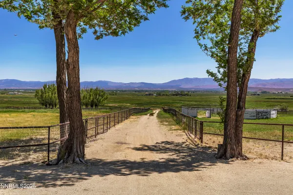 a view of house with yard and green space