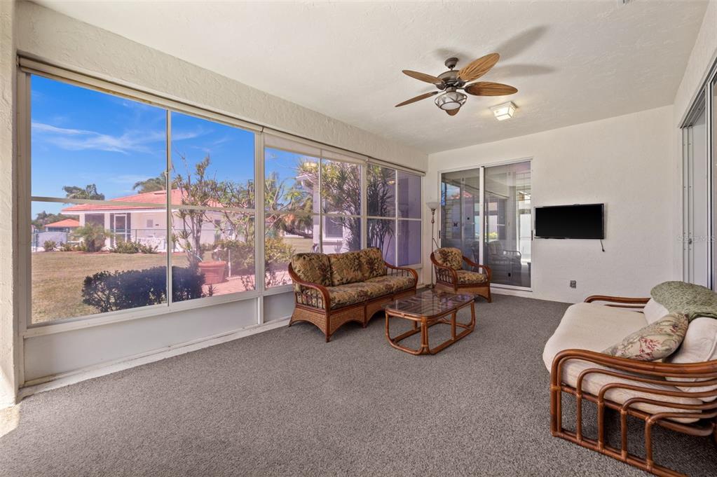 4333 Spicetree Street Venice, FL 34293 - Photo 15 of 29 a living room with furniture and a flat screen tv