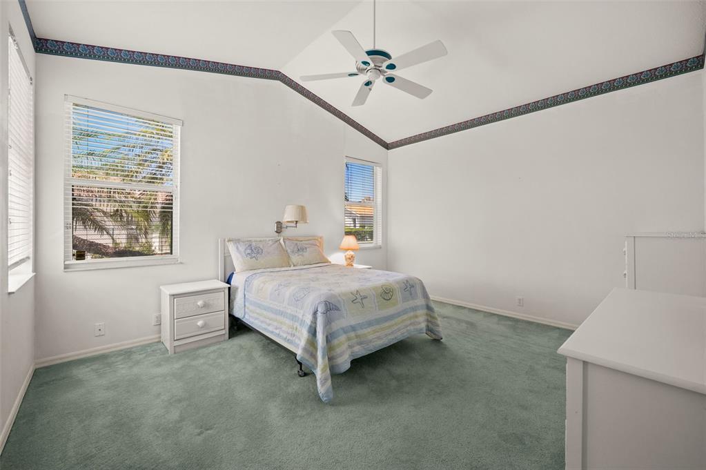 4333 Spicetree Street Venice, FL 34293 - Photo 17 of 29 a bedroom with a bed and a table