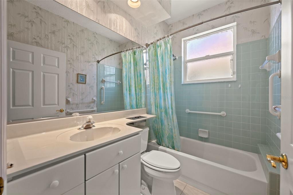 4333 Spicetree Street Venice, FL 34293 - Photo 20 of 29 a bathroom with a sink toilet and shower