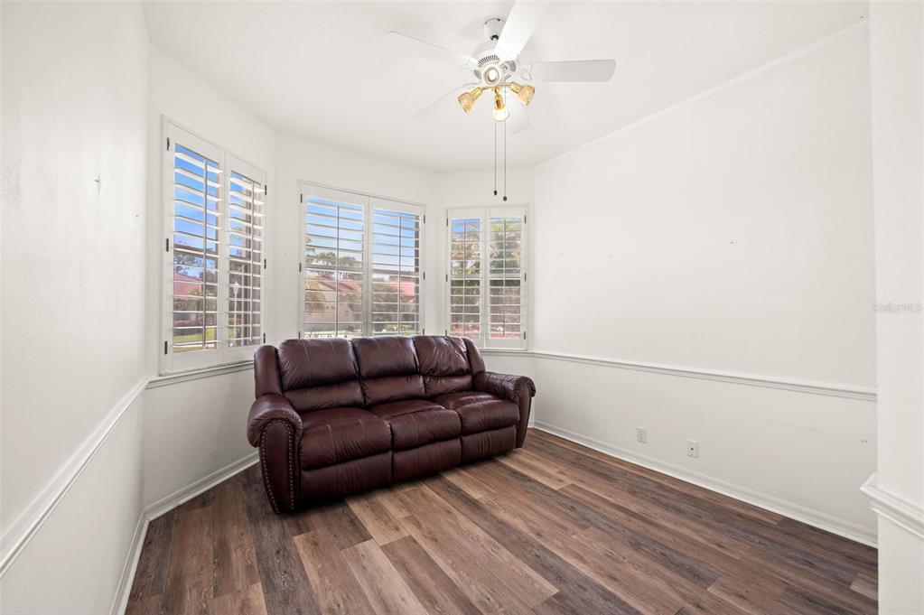 4333 Spicetree Street Venice, FL 34293 - Photo 22 of 29 a living room with furniture and a window