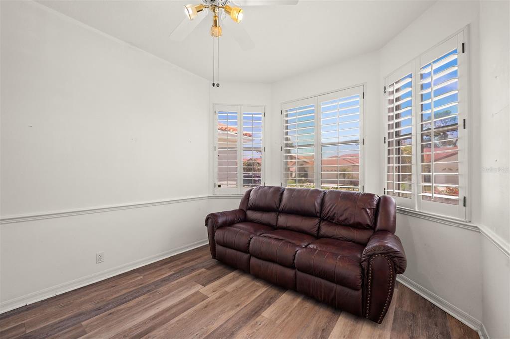 4333 Spicetree Street Venice, FL 34293 - Photo 23 of 29 a living room with furniture and a window
