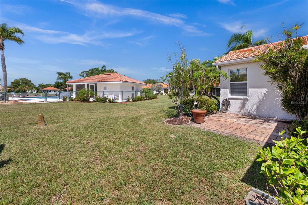4333 Spicetree Street Venice, FL 34293 - Photo 26 of 29 a front view of a house with a yard and garage