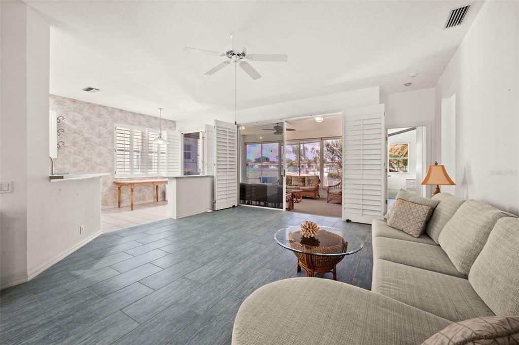 4333 Spicetree Street Venice, FL 34293 - Photo 7 of 29 a living room with furniture and a wooden floor