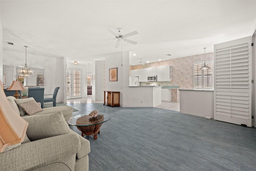 4333 Spicetree Street Venice, FL 34293 - Photo 8 of 29 a living room with furniture and kitchen view