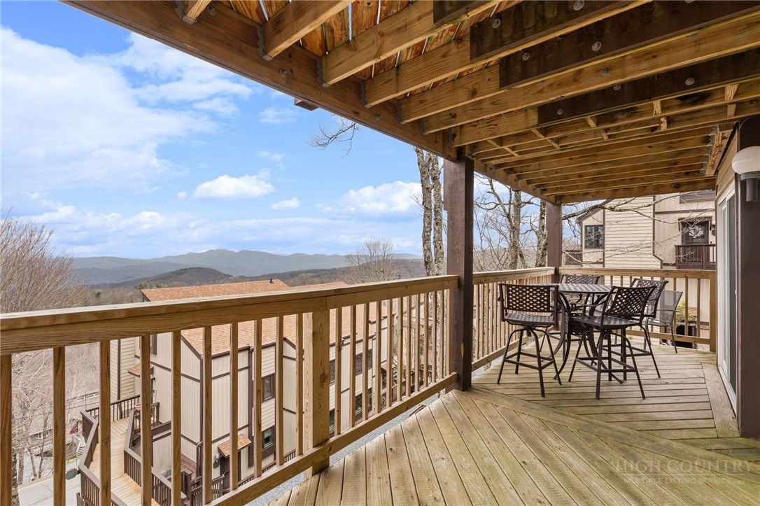 220 Northridge Road, Unit 7 Beech Mountain, NC 28604 - Photo 21 of 22 a view of a chairs and table in the patio