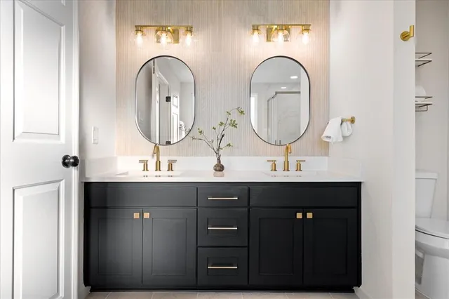 a white bath tub sitting next to a white sink