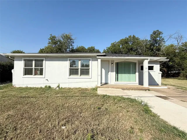 a house with trees in the background