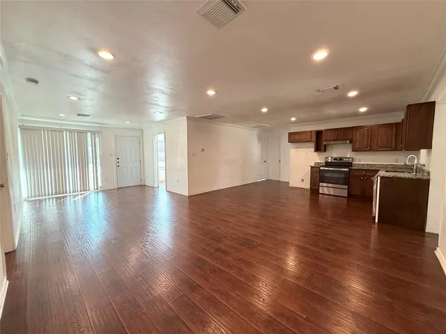 a view of kitchen with cabinets and wooden floor