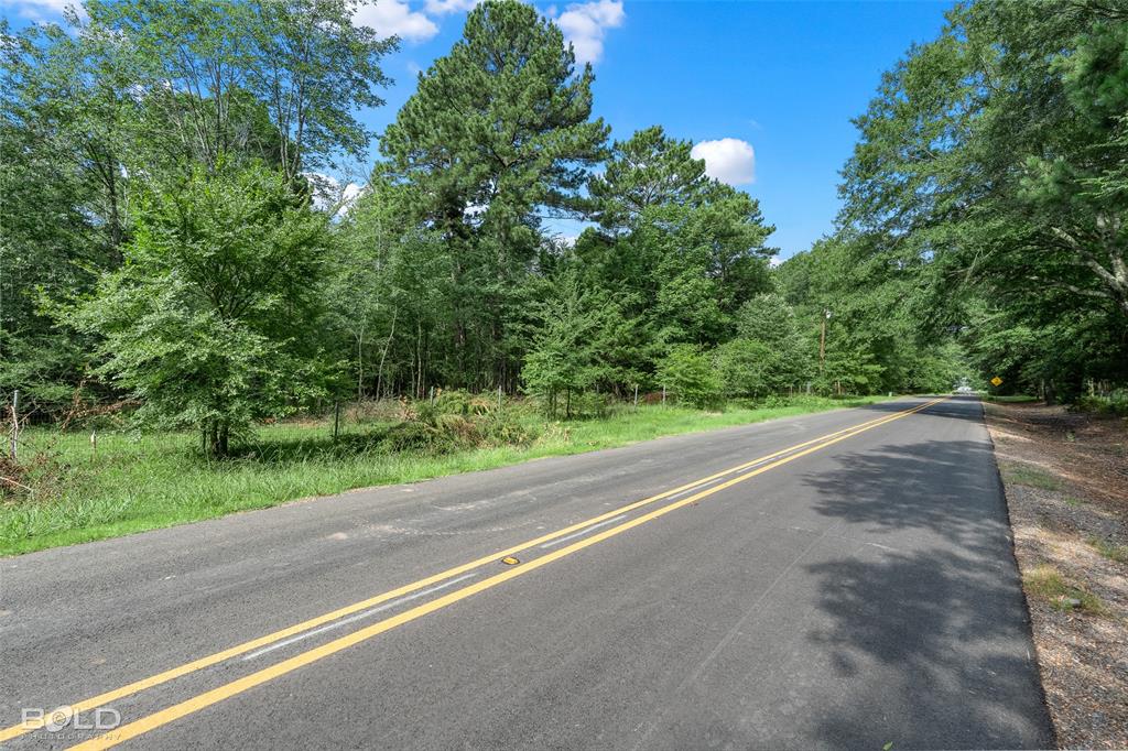 11015 Hereford Road Mooringsport, LA 71060 - Photo 8 of 18 Paved road frontage with double yellow center lines