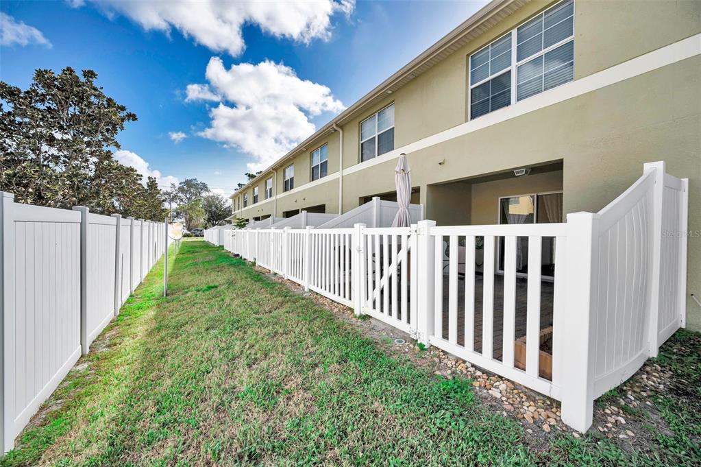 9736 Trumpet Vine Loop Trinity, FL 34655 - Photo 25 of 35 a view of a backyard with pathway
