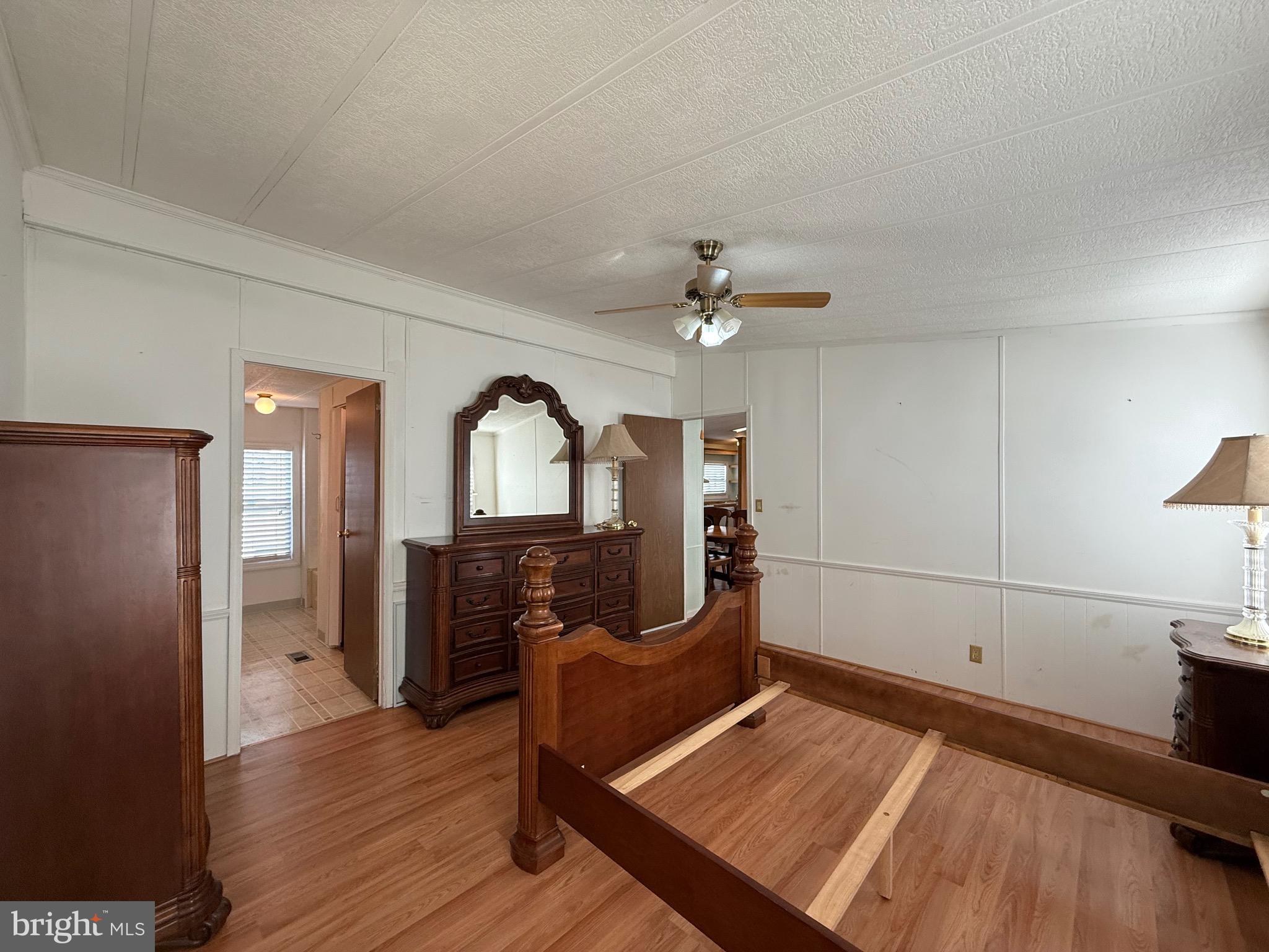 386 Indian Way Buena, NJ 08310 - Photo 16 of 53 a view of a bedroom with wooden floor and furniture