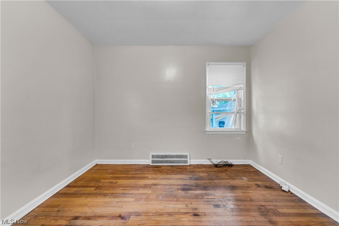 5619 Dunham Road Maple Heights, OH 44137 - Photo 7 of 19 View of wood floored empty room