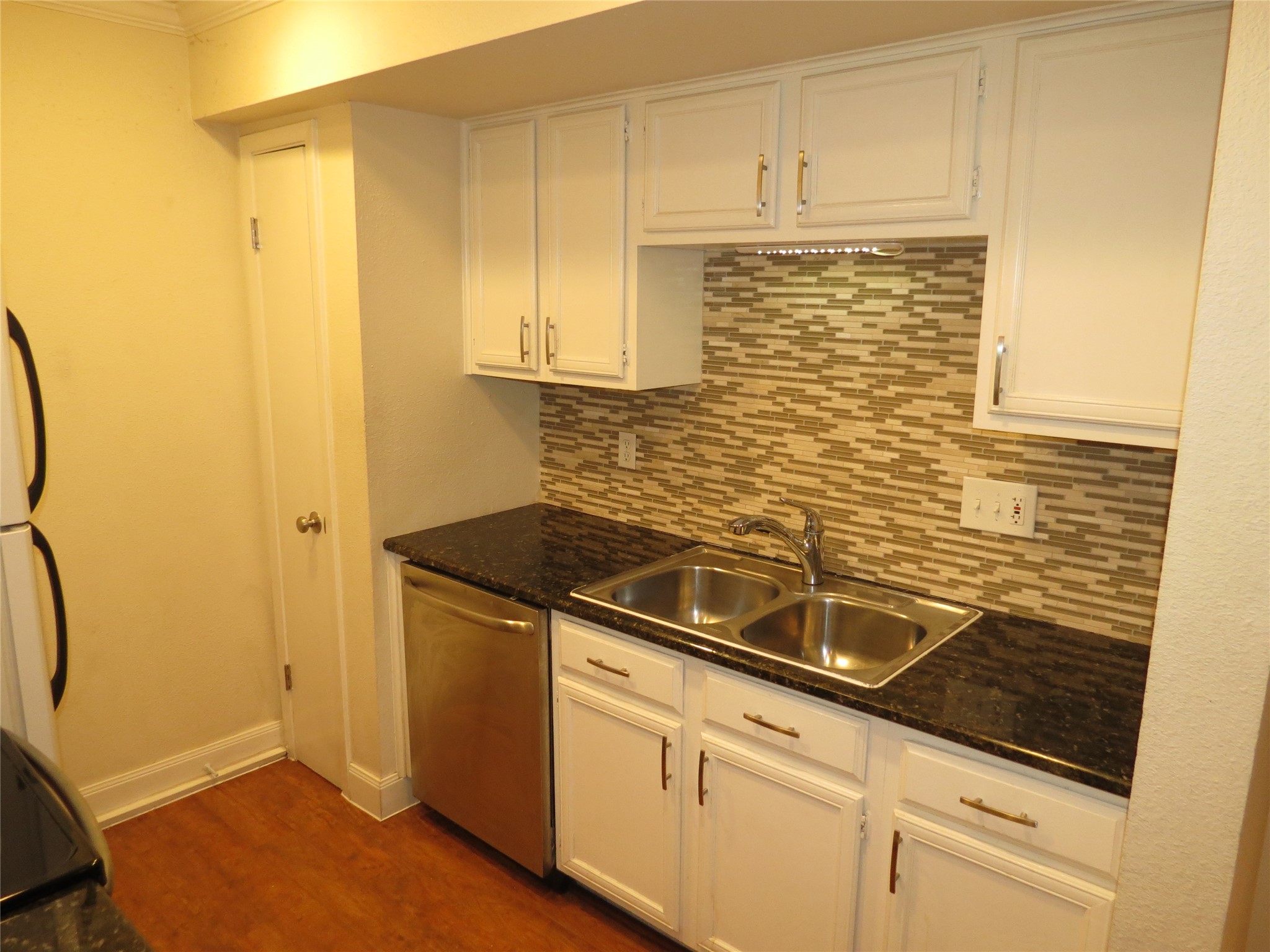 4159 Steck Avenue, Unit 269 Austin, TX 78759 - Photo 8 of 21 Sleek stainless steel appliances complement the patterned tile backsplash in this functional kitchen.