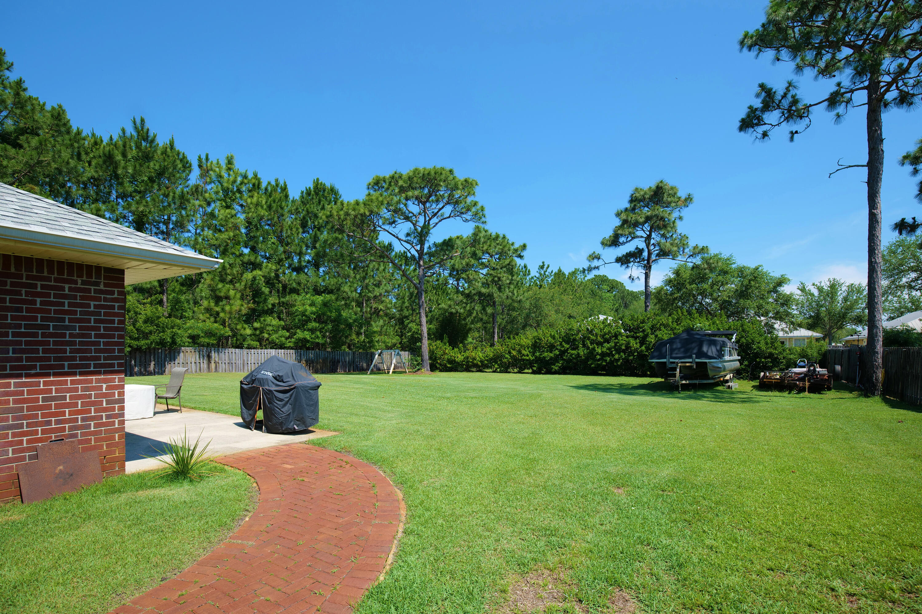 105 East Shipwreck Road Santa Rosa Beach, FL 32459 - Photo 4 of 29 a view of a garden with a fountain
