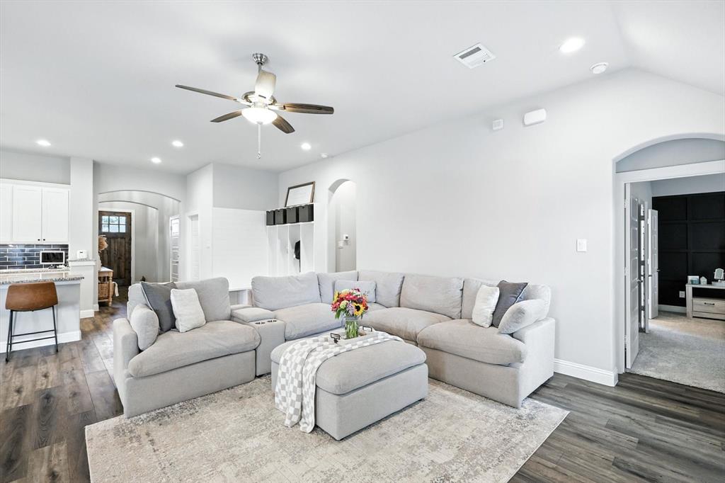 705 Chaparral Road Sanger, TX 76266 - Photo 5 of 38 a living room with furniture and a view of kitchen