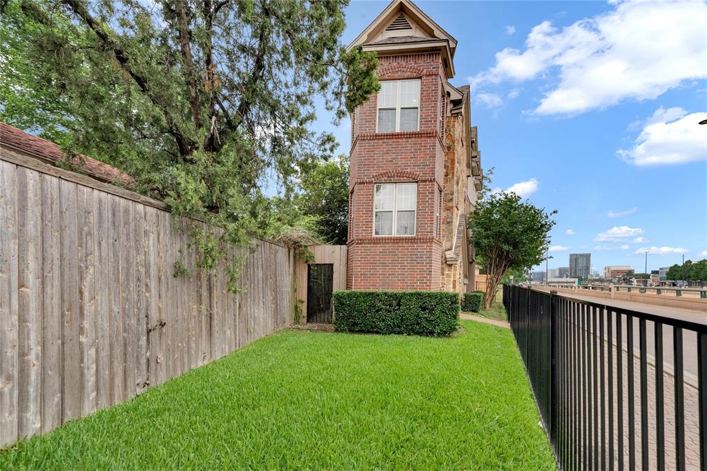 5102 Ridgedale Avenue Dallas, TX 75206 - Photo 21 of 27 Brick exterior featuring multiple windows and architectural gables