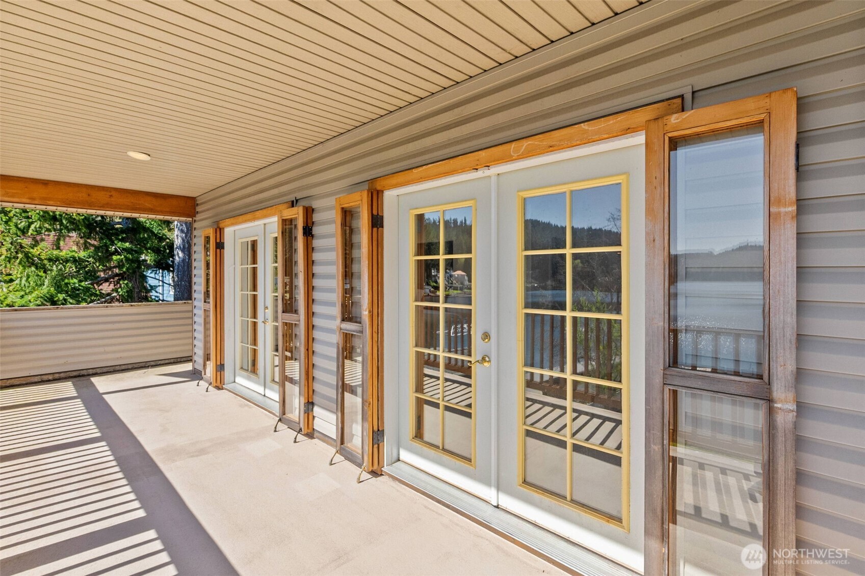 1521 Summit Lake Shore Road Northwest Olympia, WA 98502 - Photo 26 of 40 a front view of a house with a glass door