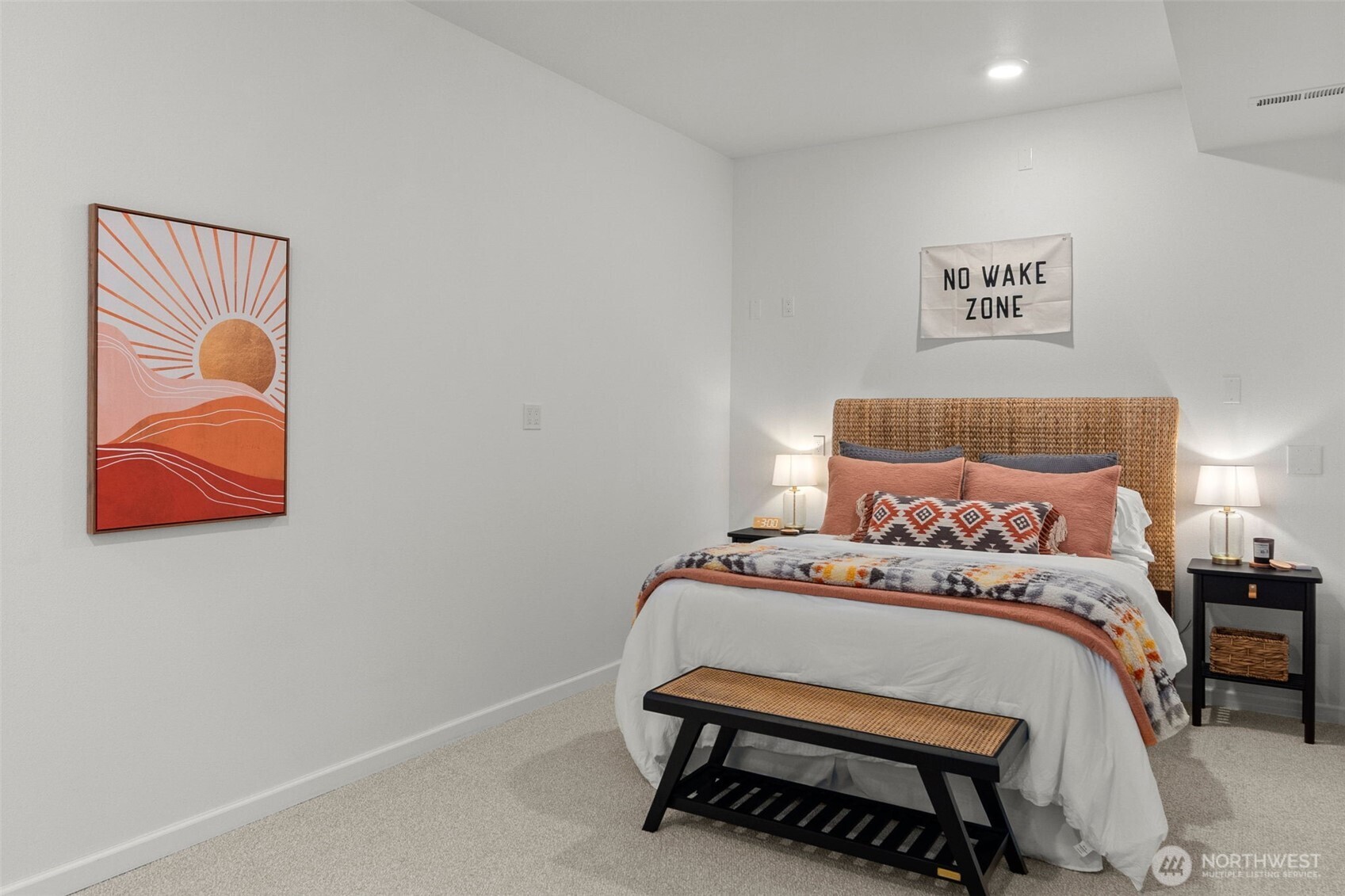 1521 Summit Lake Shore Road Northwest Olympia, WA 98502 - Photo 29 of 40 a bedroom with a bed and wall painting