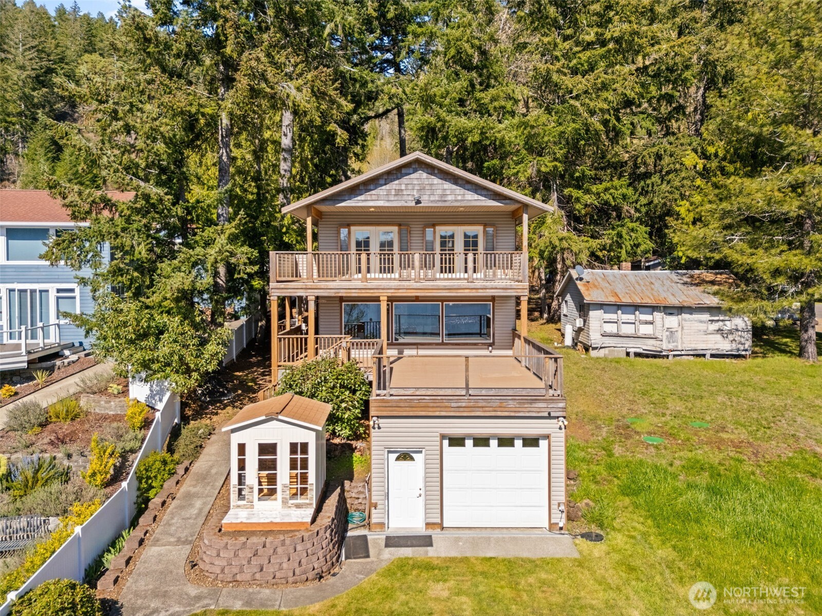 1521 Summit Lake Shore Road Northwest Olympia, WA 98502 - Photo 3 of 40 a front view of a house with a yard