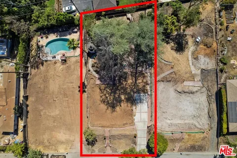 an aerial view of residential houses and outdoor space