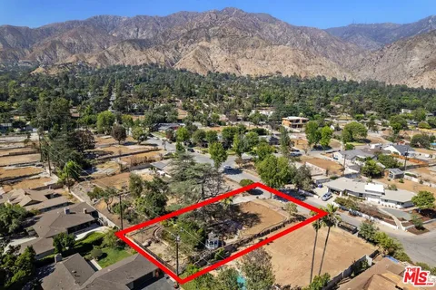an aerial view of residential house with an outdoor space