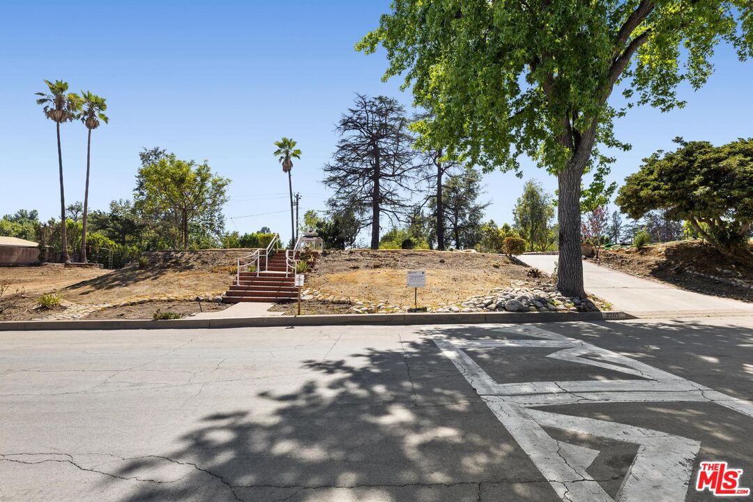 2261 Sinaloa Avenue Altadena, CA 91001 - Photo 2 of 20 a view of a road with a tree