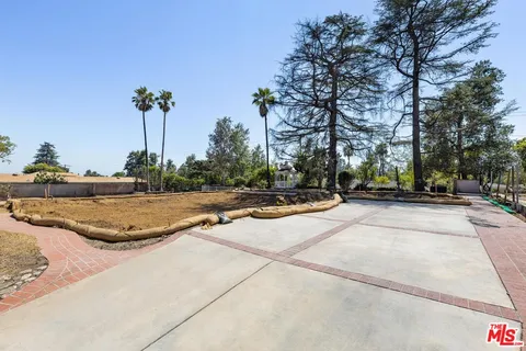 a view of a playground with basketball court