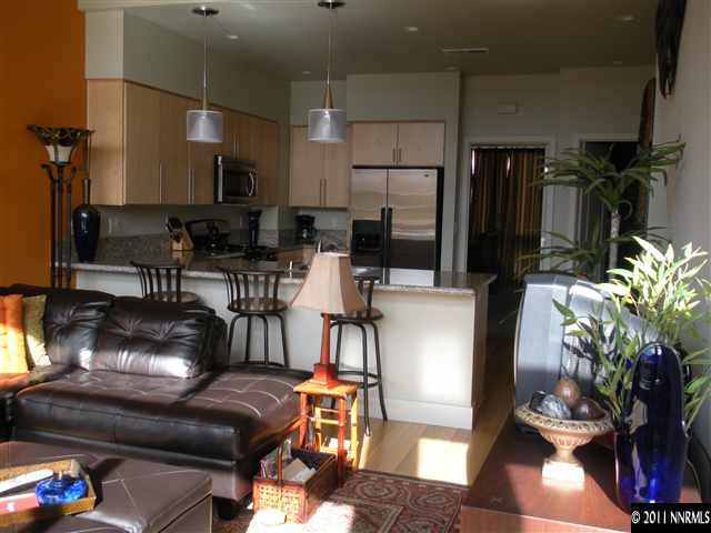 365 Pine Street Reno, NV 89501 - Photo 4 of 10 a living room with furniture and a dining table with kitchen view