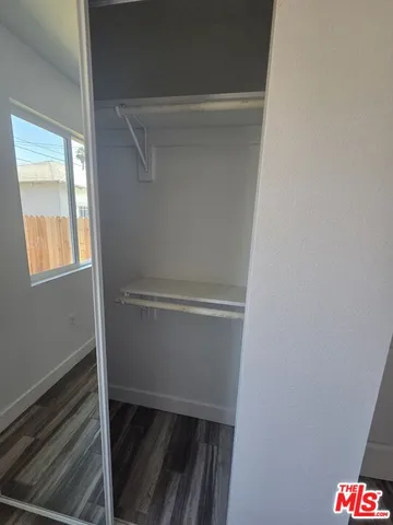 a view of an empty walk in closet