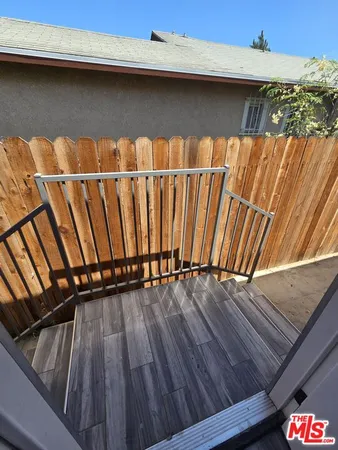 a view of outdoor space with wooden floor