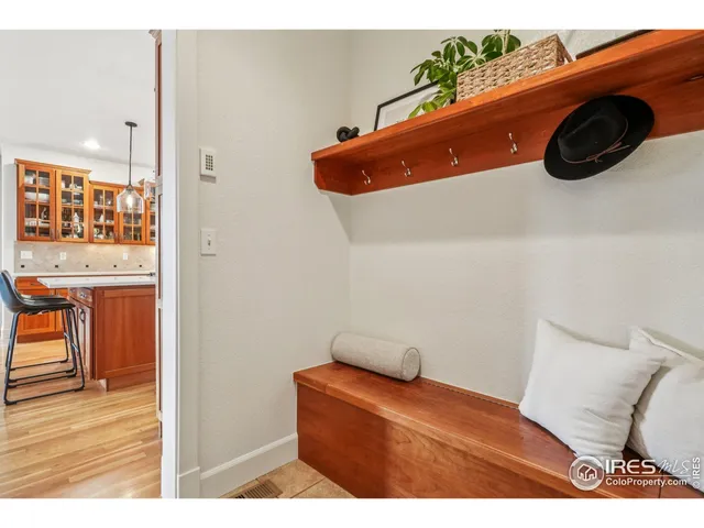 a view of living room with furniture and wooden floor