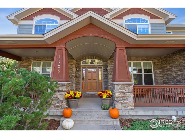 a view of open kitchen with dining table and chairs