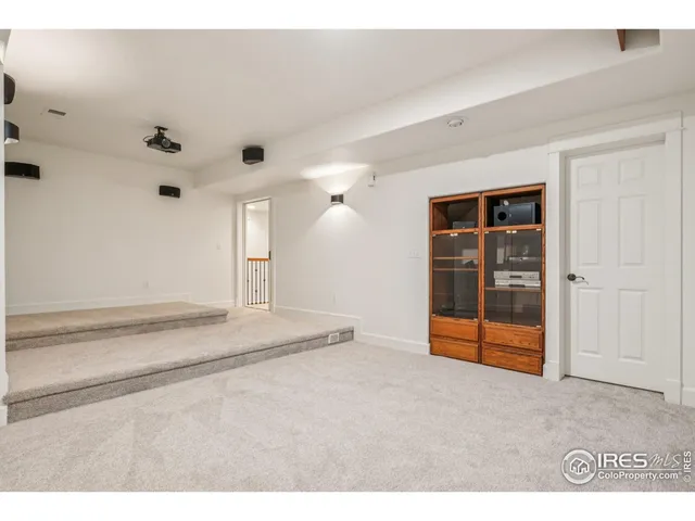 a view of empty room with ceiling fan