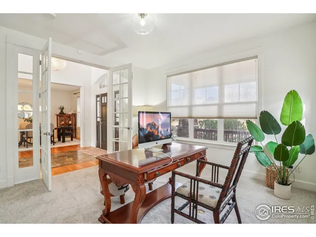 a workspace with furniture and window