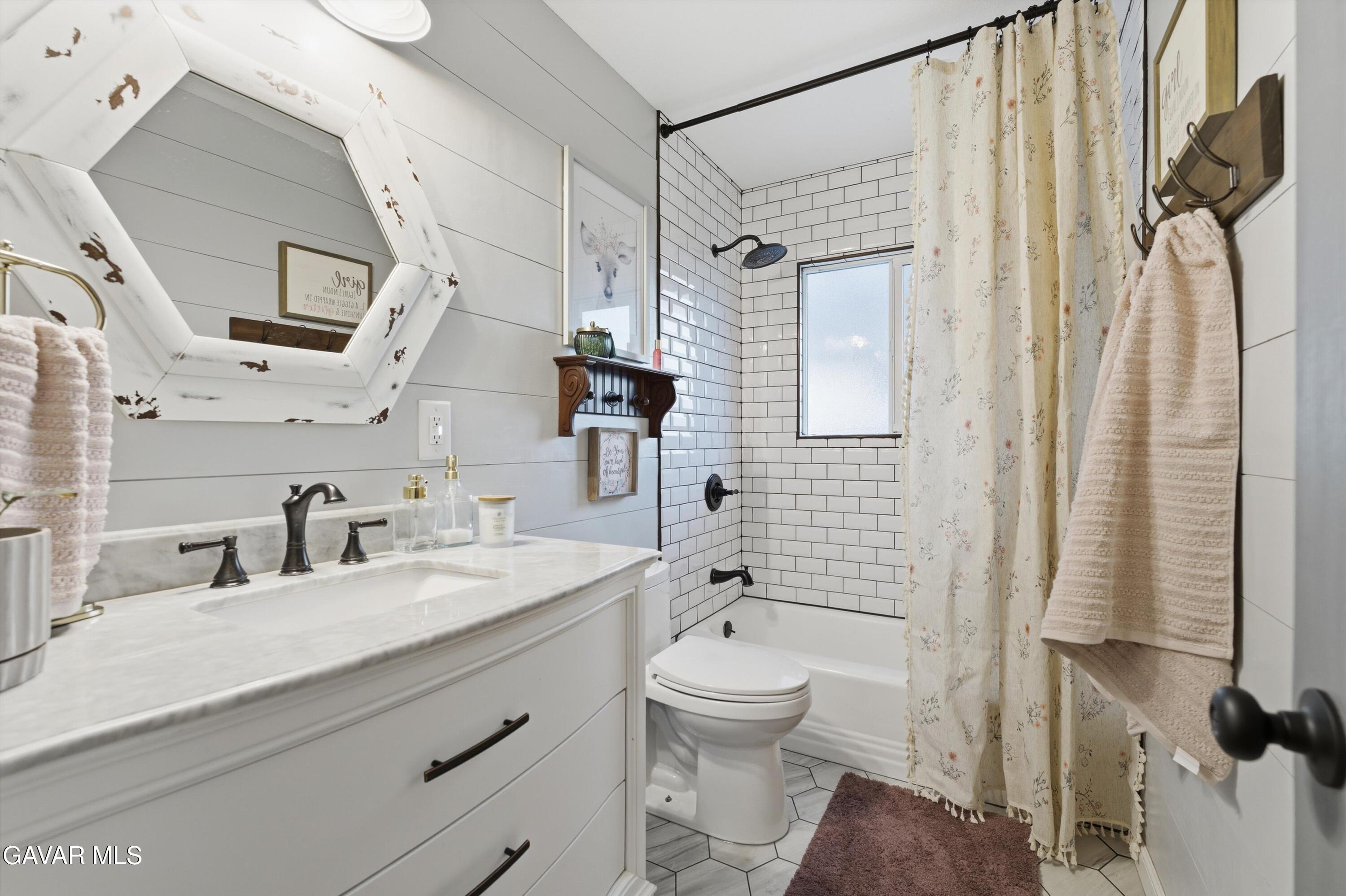 43851 Fern Avenue Lancaster, CA 93534 - Photo 13 of 20 a bathroom with a sink a toilet and shower