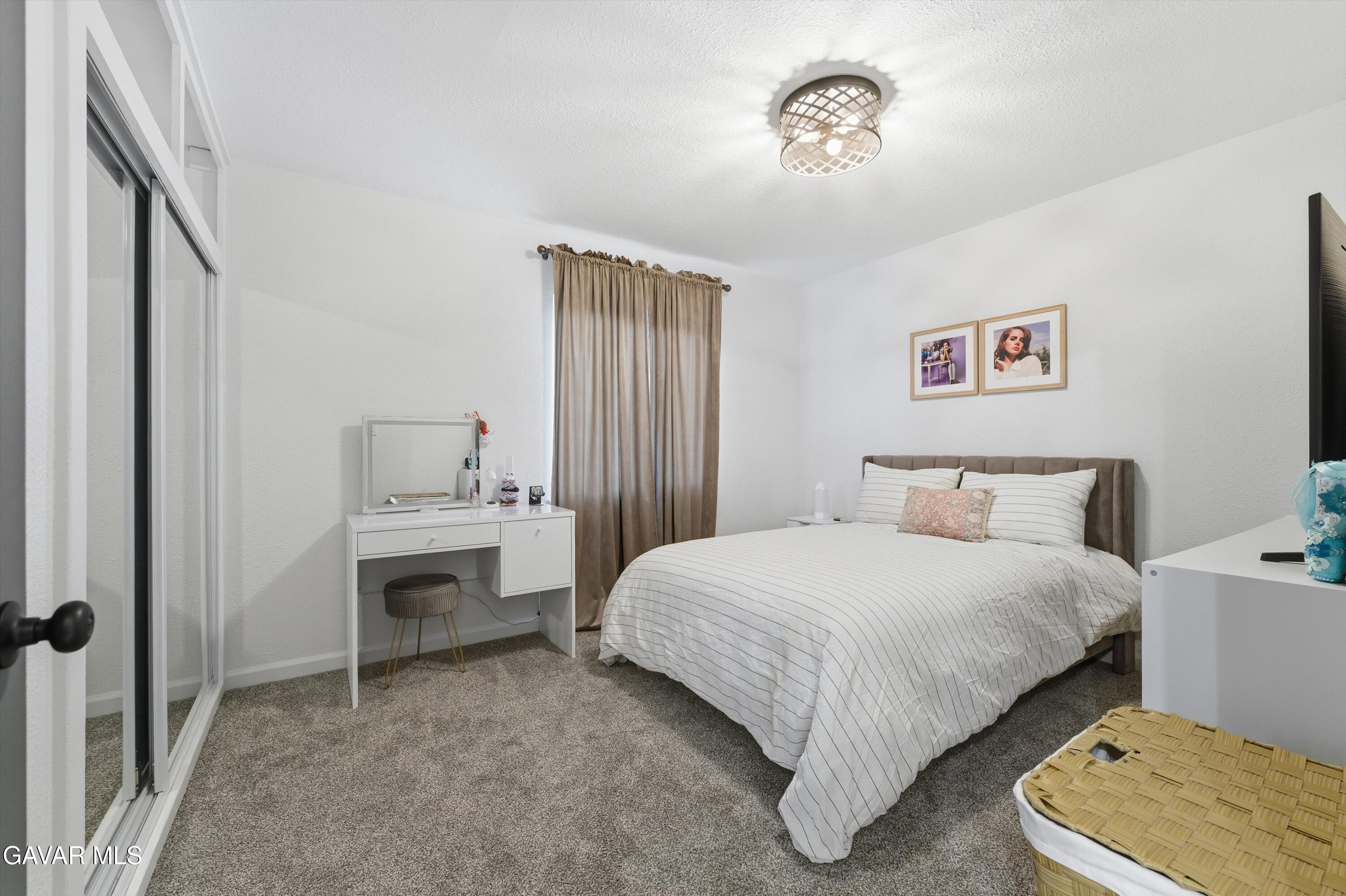 43851 Fern Avenue Lancaster, CA 93534 - Photo 16 of 20 a bedroom with a bed and a window