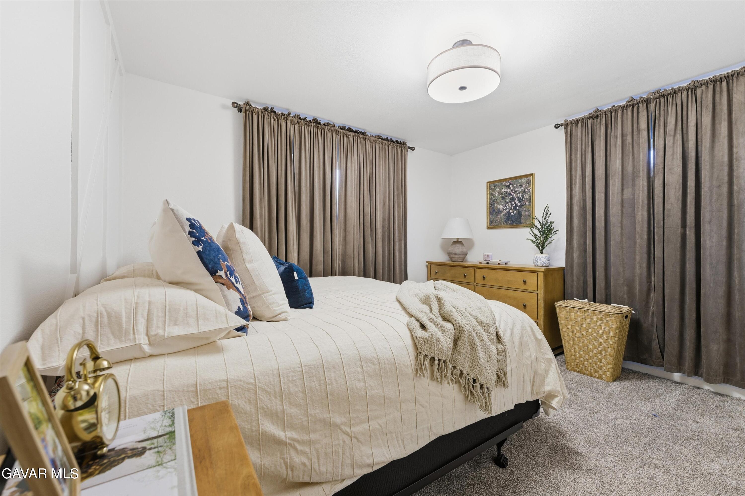 43851 Fern Avenue Lancaster, CA 93534 - Photo 17 of 20 a bedroom with bed and window