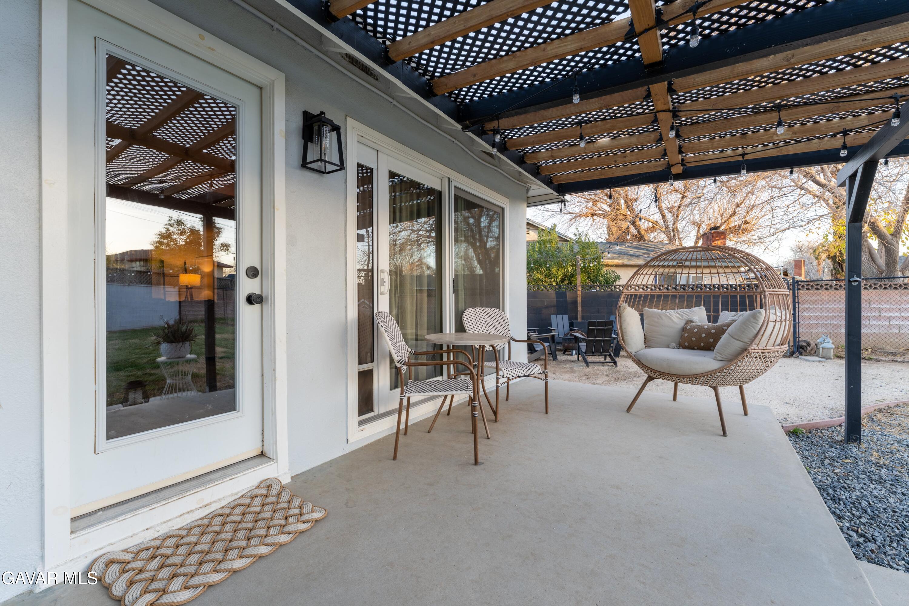 43851 Fern Avenue Lancaster, CA 93534 - Photo 18 of 20 a view of a porch with chairs and potted plant