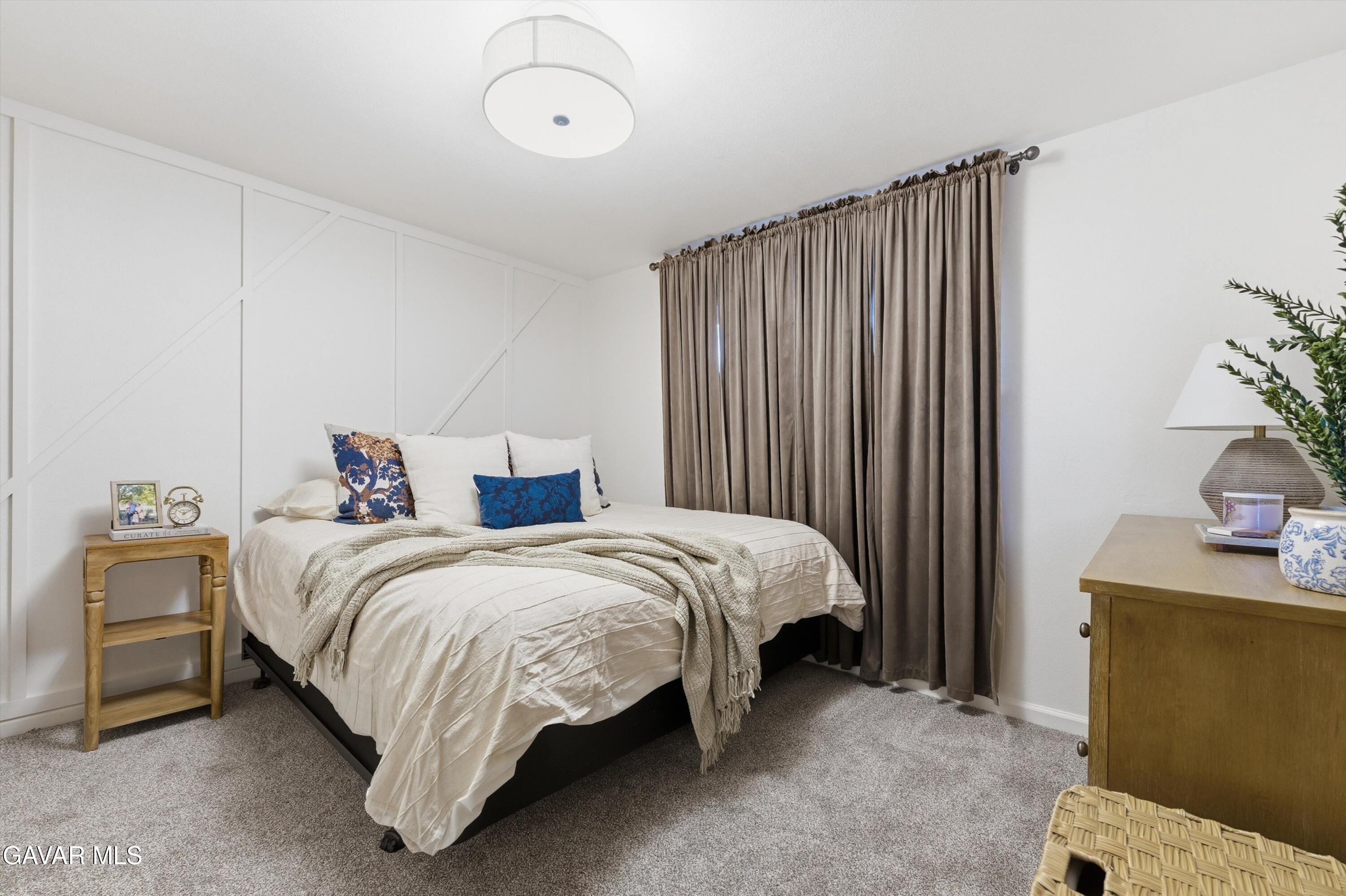 43851 Fern Avenue Lancaster, CA 93534 - Photo 6 of 20 a bed room with a bed and a chair