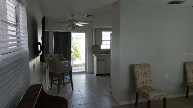 a view of a livingroom with furniture window and wooden floor