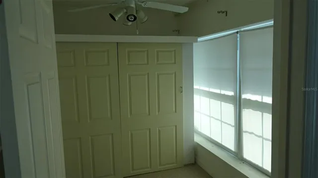 a bathroom with a shower and a window