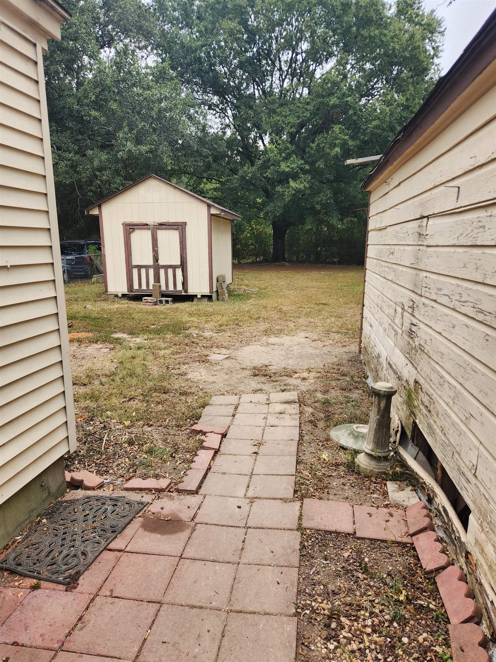 4170 Elliston Road Memphis, TN 38111 - Photo 6 of 19 a view of a backyard with a tree