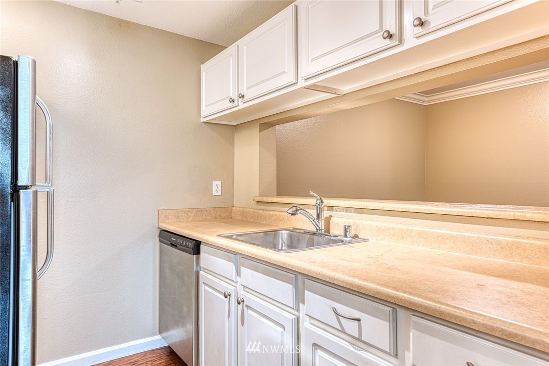 10831 Northeast 147th Lane, Unit R104 Bothell, WA 98011 - Photo 10 of 15 a bathroom with a sink and a mirror