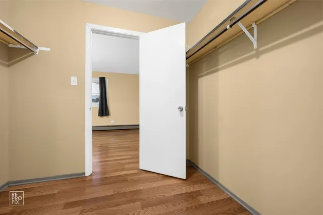a view of a small space with wooden floor
