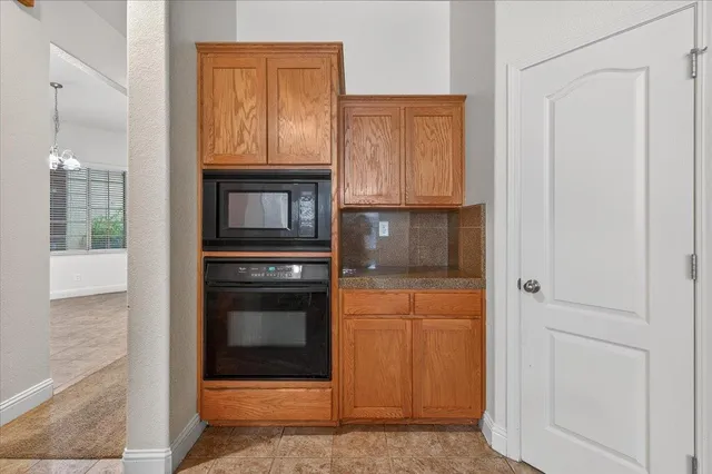 a spacious bathroom with a sink vanity and mirror