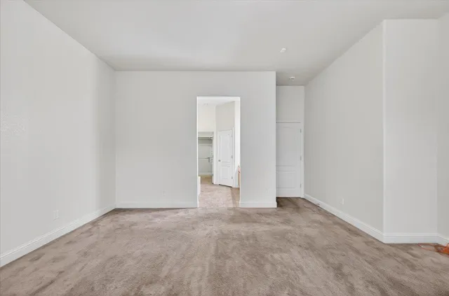a spacious bathroom with a double vanity sink mirror and shower
