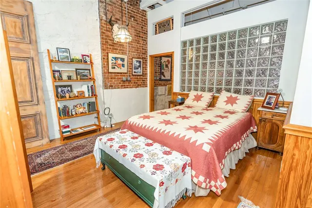 a room with lots of wooden furniture and a large window